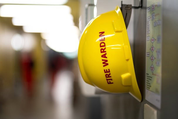Fire warden hard hat hanging on a hook