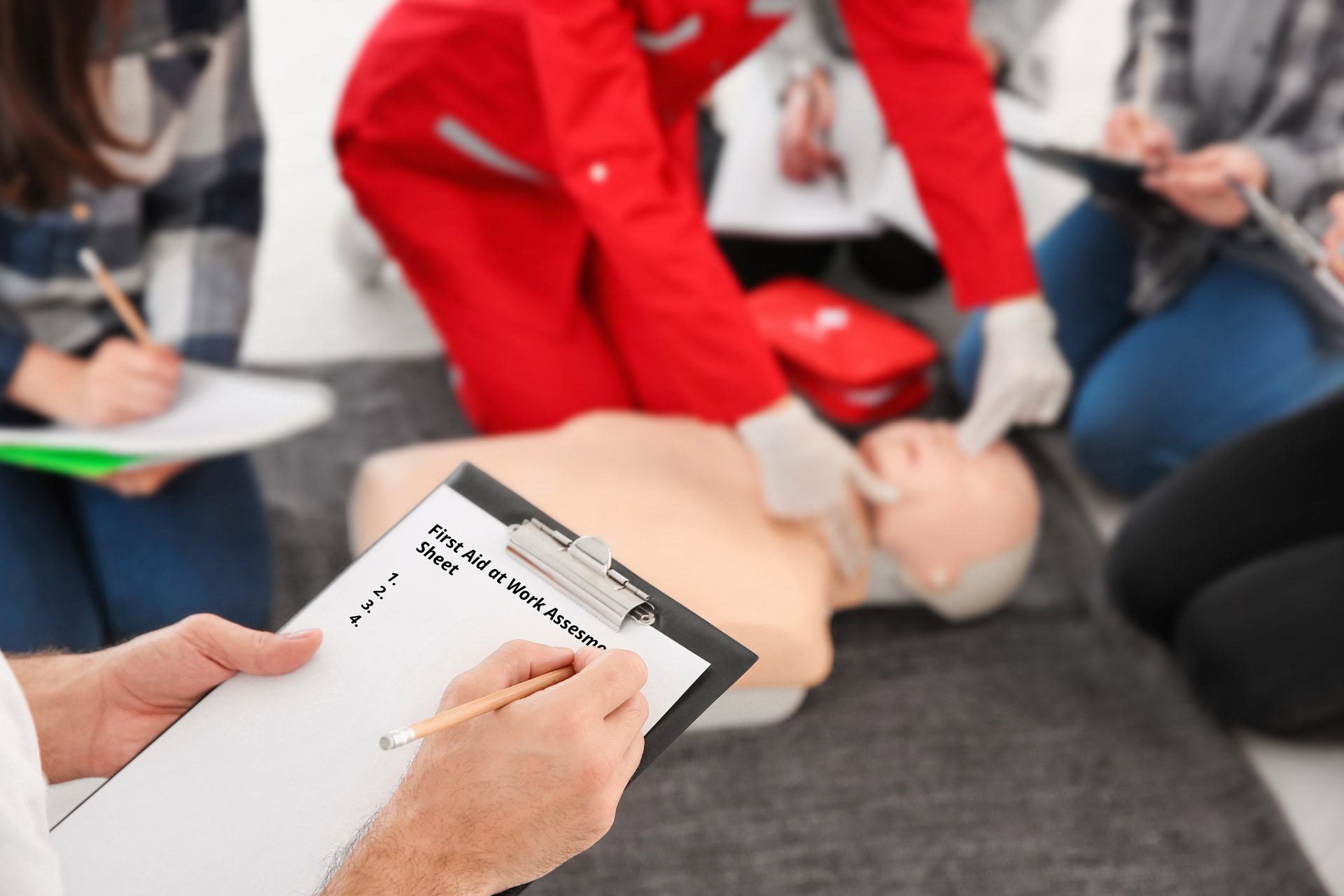 A first aid instructor assessing a course