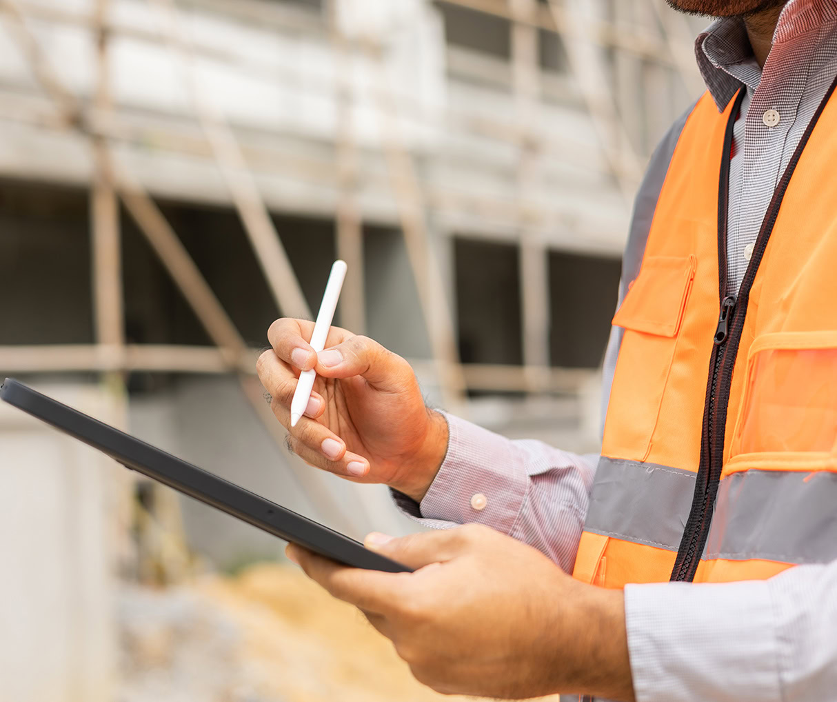 Site Manager checking a list of requirements